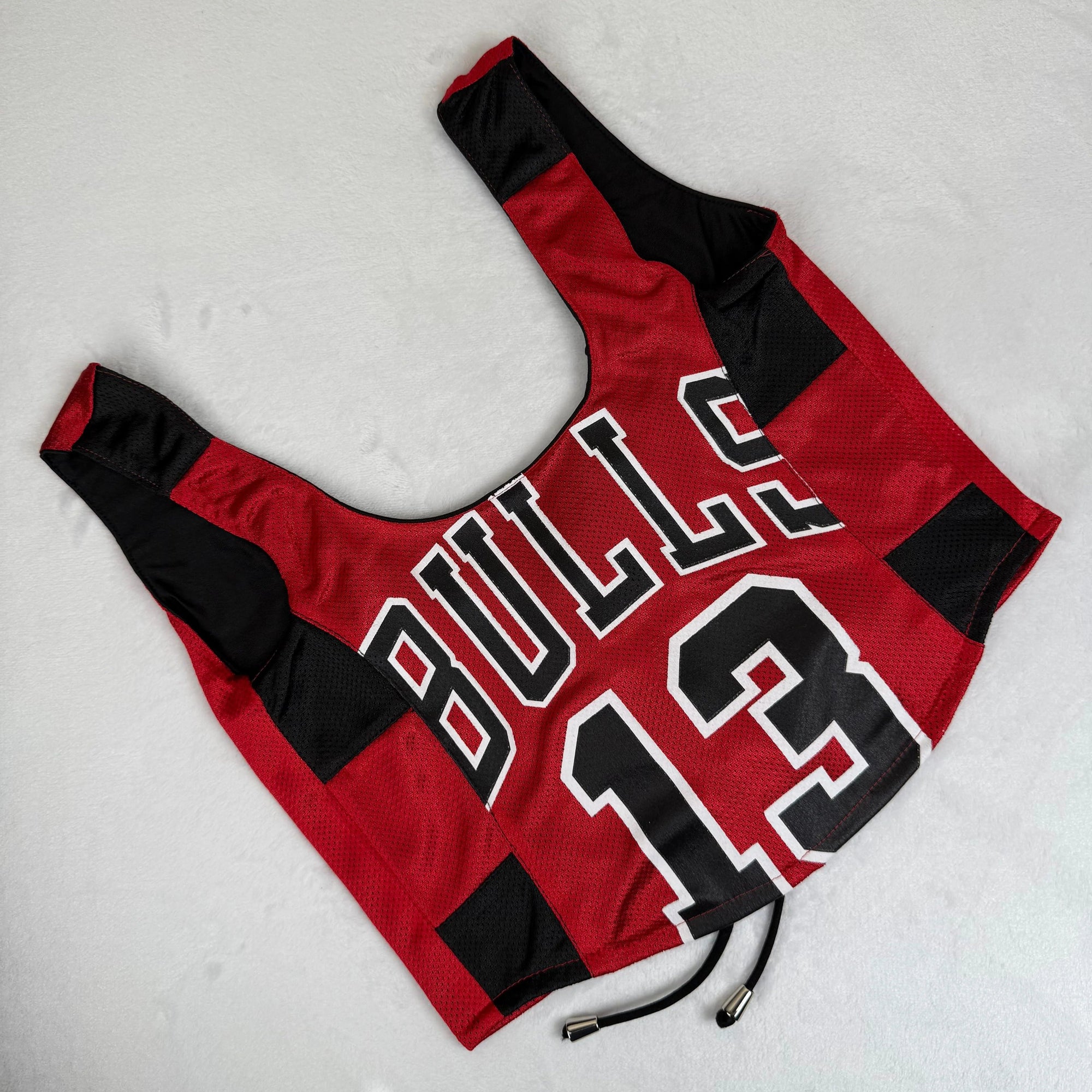 One-of-a-kind Chicago Bulls crop top jersey, perfect for fans of vintage Bulls jerseys and shirts. | Custom tank top with bold design, revamped for sporty fashion and game-day style.