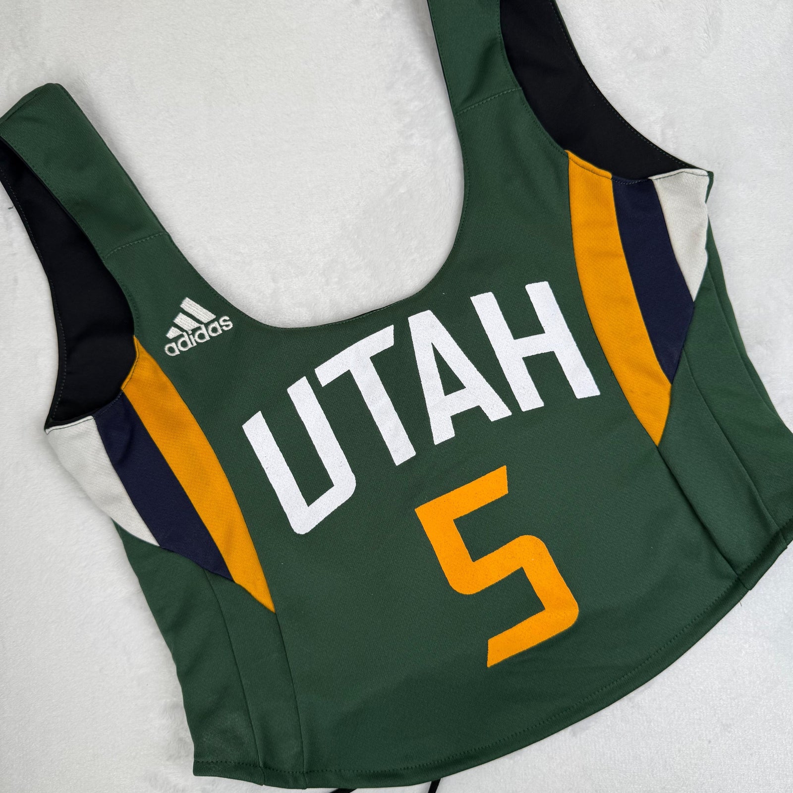 Utah Jazz green crop top with bold team graphics, stylish design, and sustainably upcycled fabric, perfect for eco-conscious fans who love sports and fashion.