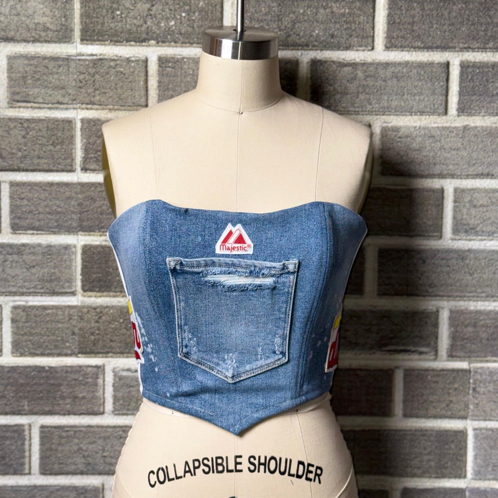 Revamped Cardinals corset top with denim and Majestic patch, perfect for women’s Cardinals apparel fans