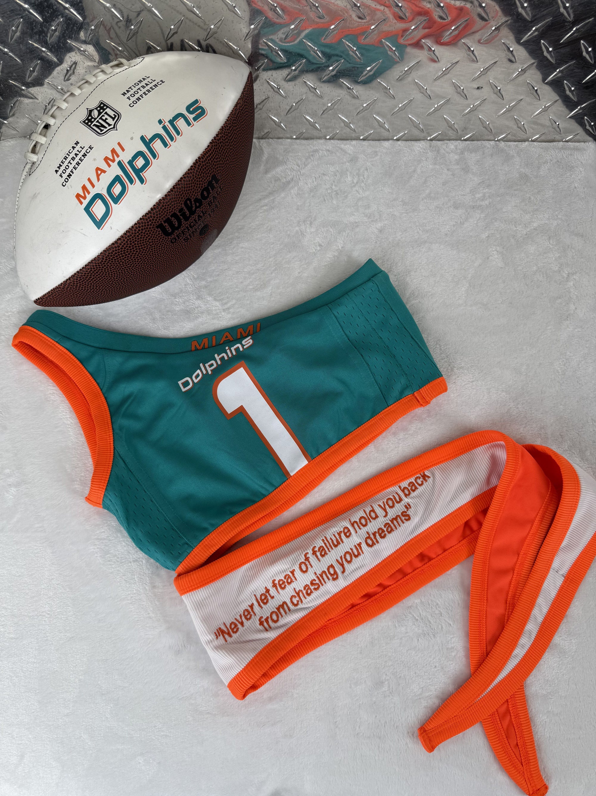 Custom Miami Dolphins crop top for women, made from sustainable reworked materials with inspirational quote details.